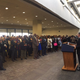 Sen. Mark Warner, D-Va., in red tie at right, watches Sen. Tim Kaine, D-Va., address voters and politicians Wednesday in a U.S. Senate office building. (Twitter)